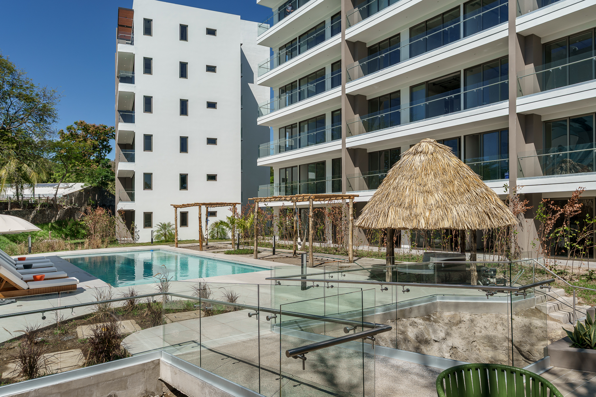 Pool and lounge area at a modern residential development.