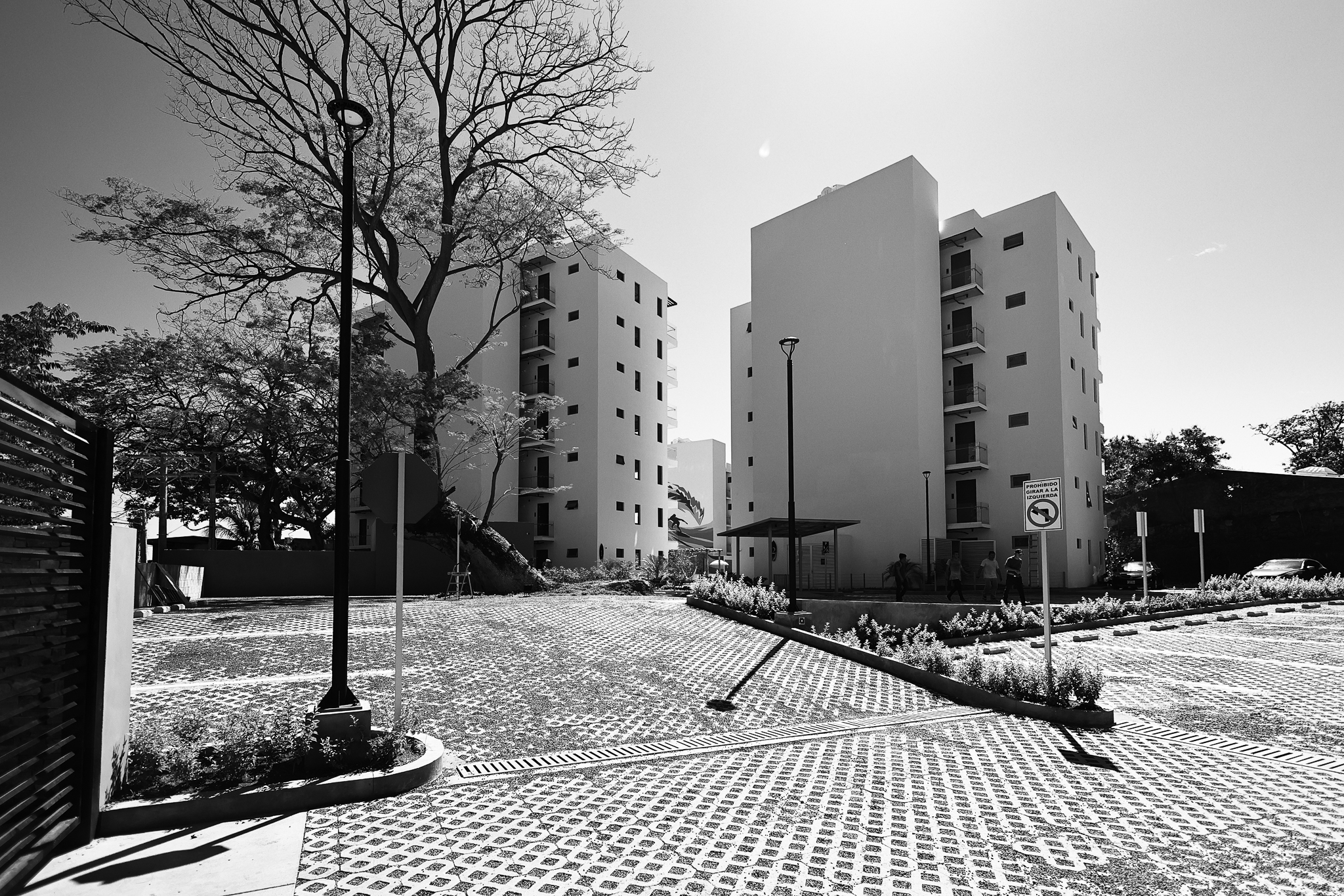Modern residential building with landscaped gardens.