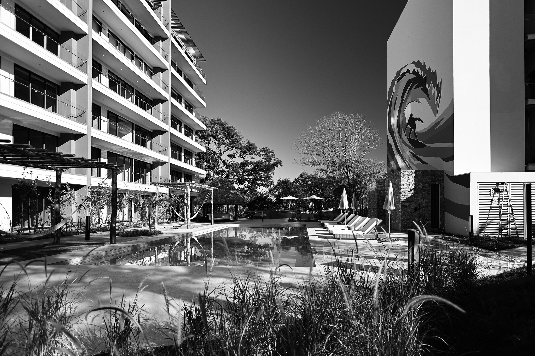 Pool set in a contemporary residential architectural setting.