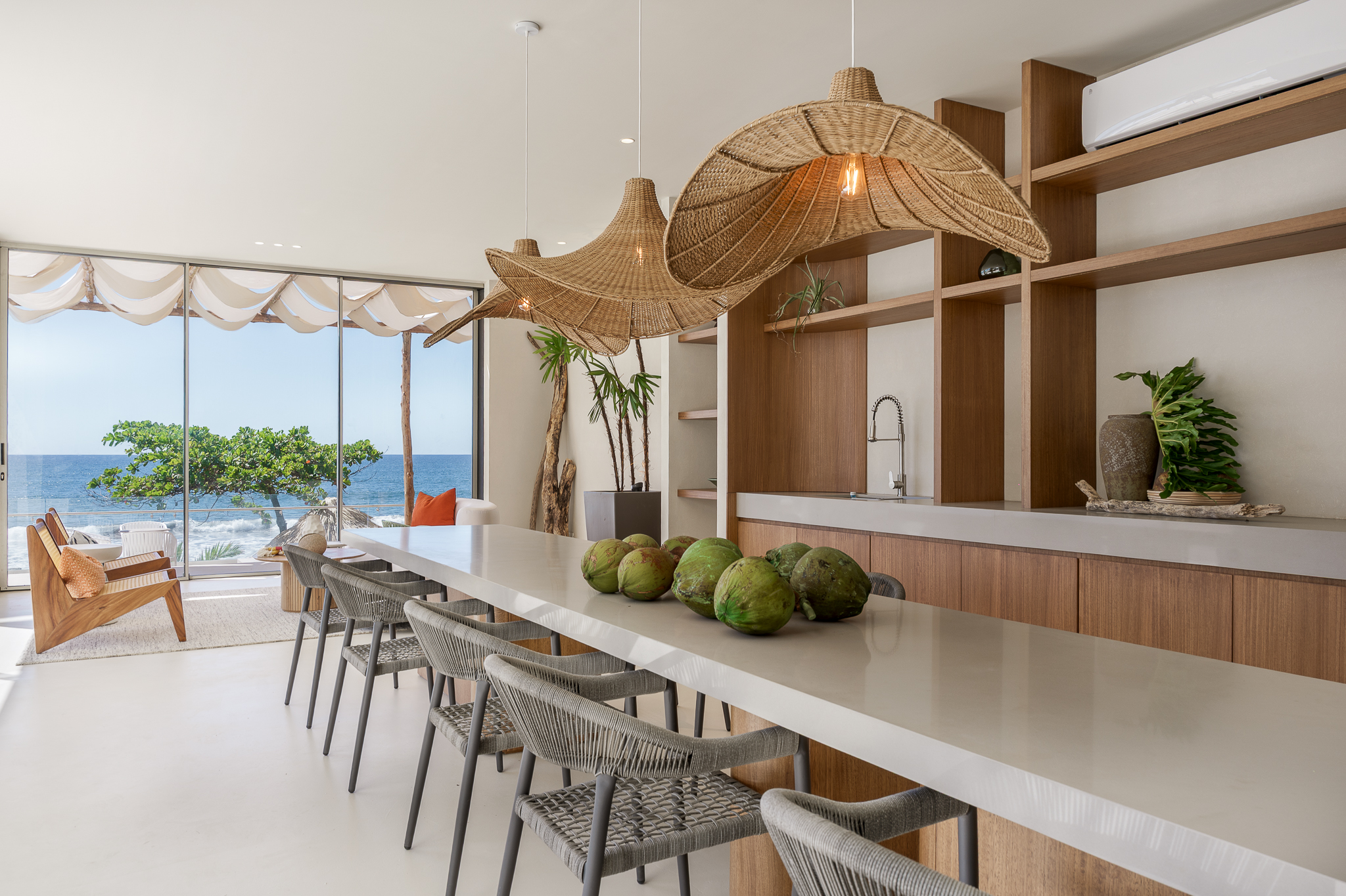 Interior view of a modern kitchen with marble counter and natural styling.